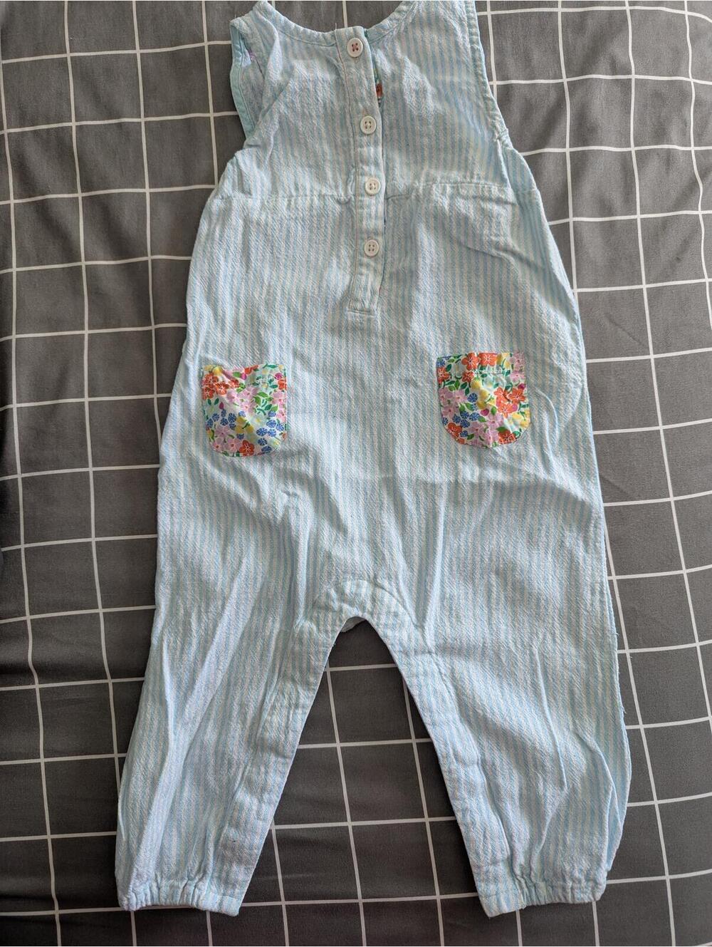 Boden seersucker stripe romper with liberty floral pockets